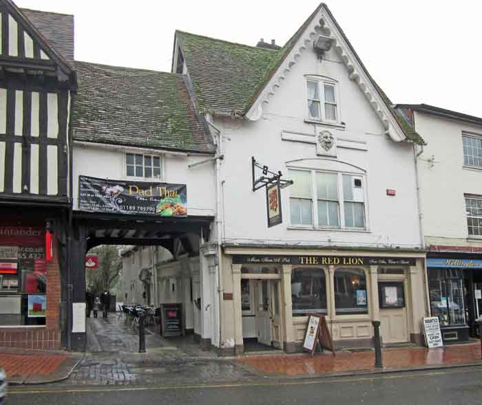 building with archway to left