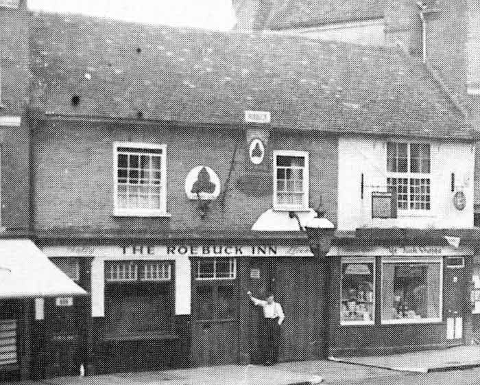 pub in terrace of shops